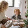 Mother giving Birthday Gift to Child, chaild is happy for the toys