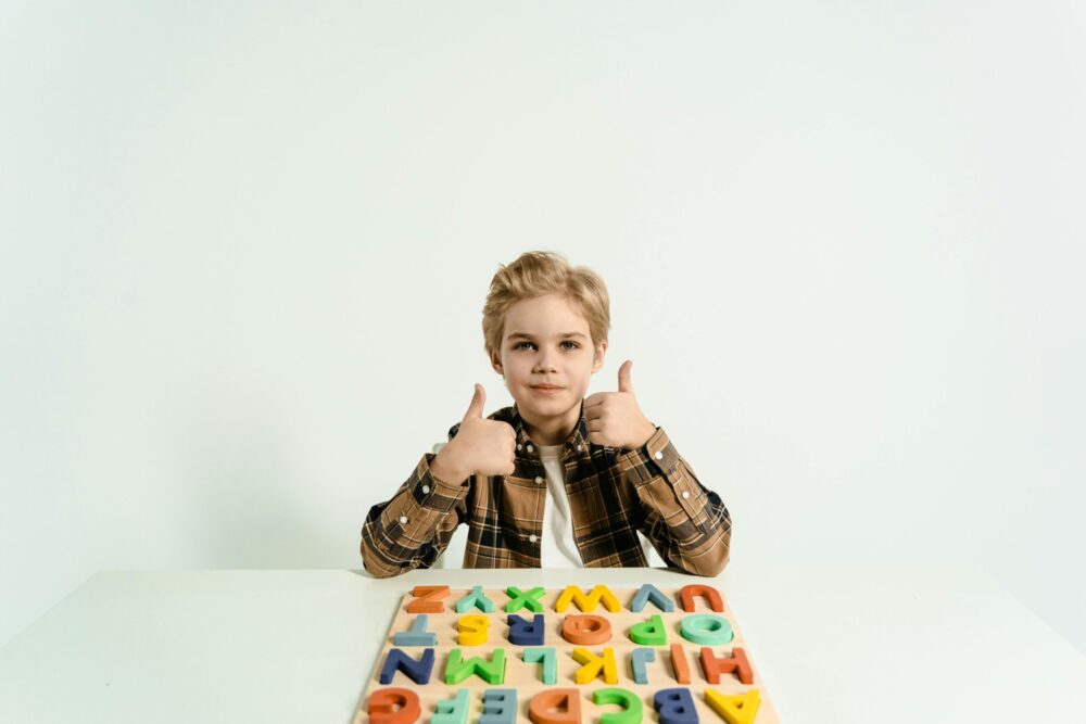 A child learning english with English Learning Toys for Kids in Pakistan stepsnsmiles