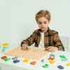 a child play with English learning toys in Pakistan from stepsnsmiles