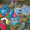 A colorful aerial view of a large water and activity park with multiple slides, splash zones, and play areas surrounded by greenery—illustrating a fun and engaging space that encourages gross motor skill development for children.