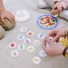 Children in Pakistan playing with interactive toys such as electronic learning boards and augmented reality books.