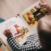 Parent and child reading an interactive storybook about a fox, promoting language development and communication skills in autism home therapy in Pakistan.