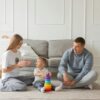 Autistic boy playing with his father and mother with developmental Toy from Steps N Smiles Autism Tool Kit
