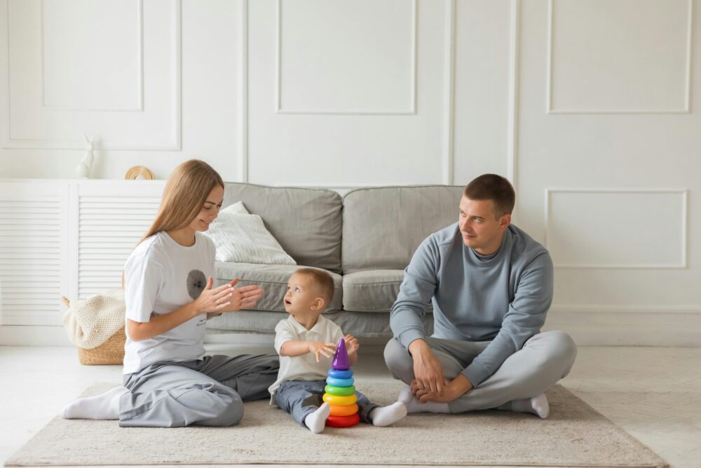 Autistic boy playing with his father and mother with developmental Toy from Steps N Smiles Autism Tool Kit