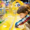 a child watching Montessori Toys in Pakistan on a shelf of stepsnsmiles.com
