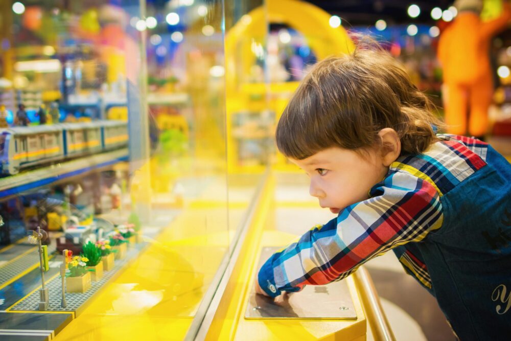 a child watching Montessori Toys in Pakistan on a shelf of stepsnsmiles.com