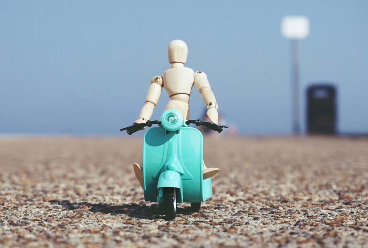 Image showing a character toy riding a scooter toy from stepsnsmiles Pakistan Online